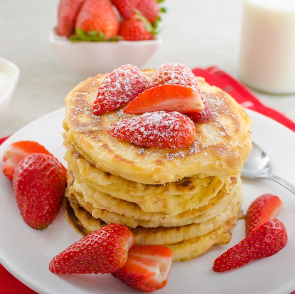 Dutch Baby Pancakes with Brown Sugar Greek Yogurt and Strawberries title